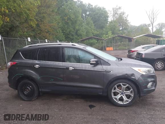 2017 Ford Escape Titanium with VIN 1FMCU9J93HUA89369, listed as a IAAI auction lot 43234896 with 119,278 mi miles and . Bid and sale history available at DreamBid. Image 13.
