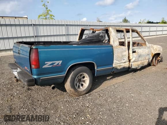 1997 GMC Sierra 1500 z VIN 1GTEC19R5VE506213, wystawiony jako Copart lot #65234385 z przebiegiem Nie podano mil oraz Szkoda całkowita • Salvage title. Historia ofert i sprzedaży dostępna na DreamBid. Obrazek 3.
