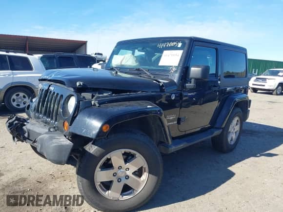 2012 Jeep Wrangler Sahara z VIN 1C4GJWBGXCL104006, wystawiony jako IAAI lot #41470054 z przebiegiem 148 472 mil mil oraz . Historia ofert i sprzedaży dostępna na DreamBid. Obrazek 2.