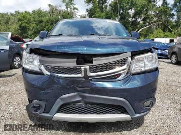 2014 Dodge Journey SXT with VIN 3C4PDCBG2ET217784, listed as a Copart auction lot 60124435 with 104,179 mi miles and Salvage title. Bid and sale history available at DreamBid. Image 5.