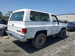 1990 Chevrolet Blazer с VIN 1GNEV18K5LF144221, выставлен на аукционе Copart как лот 52296175 с пробегом 114 593 миль миль и Списание • Salvage title. История ставок и продаж доступна на DreamBid. Изображение 3.