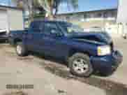 2006 Dodge Dakota SLT with VIN 1D7HW48K26S704816, listed as a Copart auction lot 56071985 with 105,189 mi miles and Salvage title. Bid and sale history available at DreamBid. Image 4.