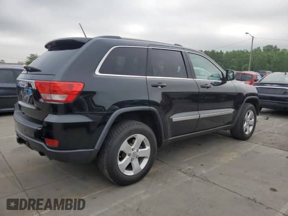 2012 Jeep Grand Cherokee Laredo с VIN 1C4RJEATXCC317054, выставлен на аукционе Copart как лот 63057615 с пробегом 159 633 миль миль и Списание • Salvage title. История ставок и продаж доступна на DreamBid. Изображение 3.