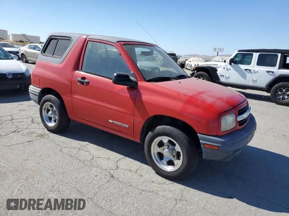 1999 Chevrolet Tracker z VIN 2CNBE18C9X6904523, wystawiony jako Copart lot #67675345 z przebiegiem 124 806 mil mil oraz Czysty tytuł • Clean title. Historia ofert i sprzedaży dostępna na DreamBid. Obrazek 4.