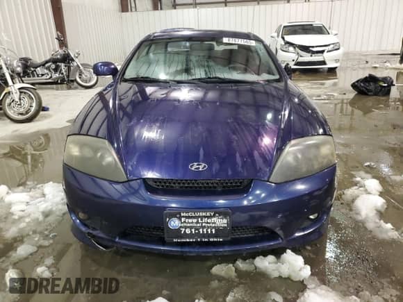 2006 Hyundai Tiburon GS с VIN KMHHM65D66U230533, выставлен на аукционе Copart как лот 87877565 с пробегом 155 039 миль миль и На запчасти • Non repairable. История ставок и продаж доступна на DreamBid. Изображение 5.