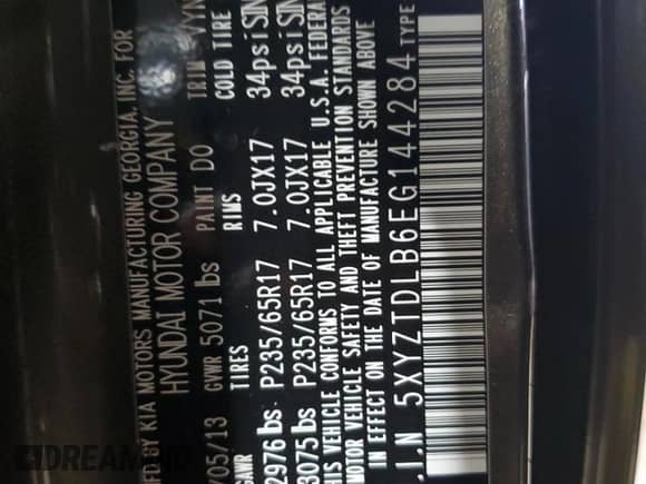 2014 Hyundai Santa Fe z VIN 5XYZTDLB6EG144284, wystawiony jako Copart lot #68639175 z przebiegiem 165 602 mil mil oraz Szkoda całkowita • Salvage title. Historia ofert i sprzedaży dostępna na DreamBid. Obrazek 13.