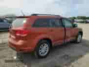 2013 Dodge Journey SXT with VIN 3C4PDCBG8DT577947, listed as a Copart auction lot 71614805 with 182,477 mi miles and Salvage title. Bid and sale history available at DreamBid. Image 3.