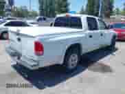 2003 Dodge Dakota SLT with VIN 1D7HL48N03S184534, listed as a IAAI auction lot 42423520 with 197,070 mi miles and . Bid and sale history available at DreamBid. Image 4.