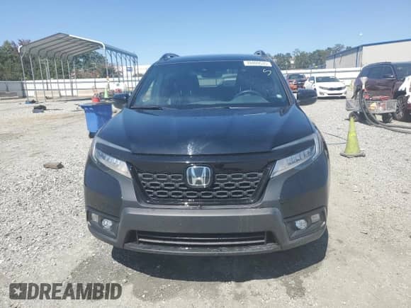 2021 Honda Passport Touring with VIN 5FNYF7H92MB004586, listed as a Copart auction lot 70409535 with 57,226 mi miles and Salvage title. Bid and sale history available at DreamBid. Image 5.
