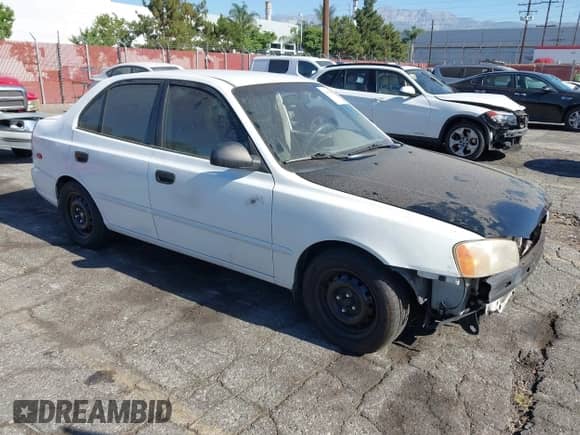2002 Hyundai Accent GL z VIN KMHCG45C42U375352, wystawiony jako IAAI lot #42699297 z przebiegiem 103 540 mil mil oraz . Historia ofert i sprzedaży dostępna na DreamBid. Obrazek 1.