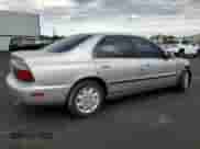 1996 Honda Accord LX z VIN 1HGCD5631TA046176, wystawiony jako Copart lot #69990845 z przebiegiem 133 087 mil mil oraz Szkoda całkowita • Salvage title. Historia ofert i sprzedaży dostępna na DreamBid. Obrazek 3.