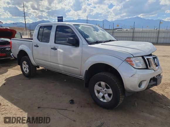 2012 Nissan Frontier SL with VIN 1N6AD0EV9CC434527, listed as a Copart auction lot 87056565 with 172,016 mi miles and Salvage title. Bid and sale history available at DreamBid. Image 4.