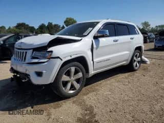 2015 Jeep Grand Cherokee Overland with VIN 1C4RJFCG2FC925936, listed as a Copart auction lot 80905225 with 136,724 mi miles and Salvage title. Bid and sale history available at DreamBid. Image 1.