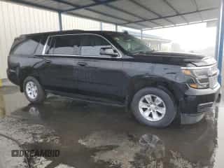2015 Chevrolet Suburban LT with VIN 1GNSCJKC7FR570828, listed as a Copart auction lot 82447725 with 64,997 mi miles and Salvage title. Bid and sale history available at DreamBid. Image 4.