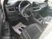 2023 Chevrolet Suburban Premier z VIN 1GNSCFKD6PR139551, wystawiony jako Copart lot #87295525 z przebiegiem 68 225 mil mil oraz Czysty tytuł • Clean title. Historia ofert i sprzedaży dostępna na DreamBid. Obrazek 8.