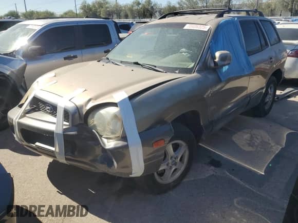2003 Hyundai Santa Fe GLS z VIN KM8SC13D53U558567, wystawiony jako Copart lot #70406325 z przebiegiem Nie podano mil oraz Nie do naprawy • Non repairable. Historia ofert i sprzedaży dostępna na DreamBid. Obrazek 1.