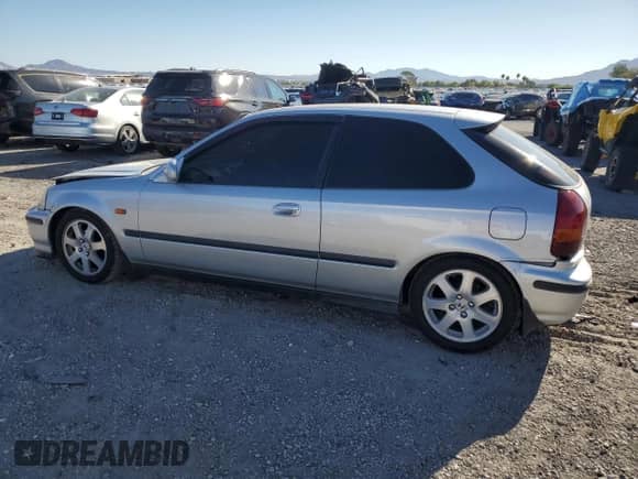 1996 Honda Civic with VIN EK31012869, listed as a Copart auction lot 82168175 with 96,715 mi miles and Salvage title. Bid and sale history available at DreamBid. Image 2.