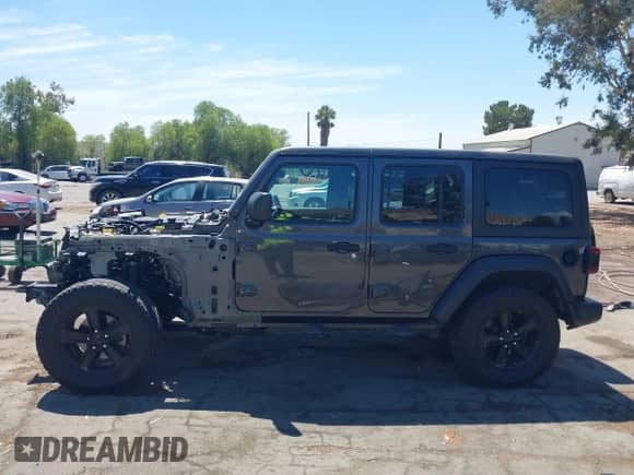 2021 Jeep Wrangler Unlimited Sport S with VIN 1C4HJXDN4MW596523, listed as a IAAI auction lot 43094668 with 128,511 mi miles and . Bid and sale history available at DreamBid. Image 15.