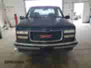 1995 GMC Sierra 1500 z VIN 2GTEC19K2S1558740, wystawiony jako Copart lot #69398185 z przebiegiem 386 899 mil mil oraz Szkoda całkowita • Salvage title. Historia ofert i sprzedaży dostępna na DreamBid. Obrazek 5.