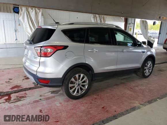 2017 Ford Escape Titanium с VIN 1FMCU0JD1HUE53434, выставлен на аукционе Copart как лот 44222165 с пробегом 129 642 миль миль и Списание • Salvage title. История ставок и продаж доступна на DreamBid. Изображение 3.