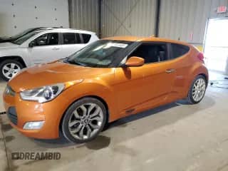2014 Hyundai Veloster z VIN KMHTC6AD4EU212324, wystawiony jako Copart lot #71514455 z przebiegiem 120 419 mil mil oraz Czysty tytuł • Clean title. Historia ofert i sprzedaży dostępna na DreamBid. Obrazek 1.