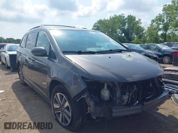 2016 Honda Odyssey Touring Elite z VIN 5FNRL5H97GB034558, wystawiony jako IAAI lot #42862918 z przebiegiem 118 891 mil mil oraz . Historia ofert i sprzedaży dostępna na DreamBid. Obrazek 1.