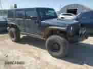 2008 Jeep Wrangler Unlimited Rubicon z VIN 1J8GA69198L550682, wystawiony jako Copart lot #57333575 z przebiegiem 176 224 mil mil oraz Szkoda całkowita • Salvage title. Historia ofert i sprzedaży dostępna na DreamBid. Obrazek 4.