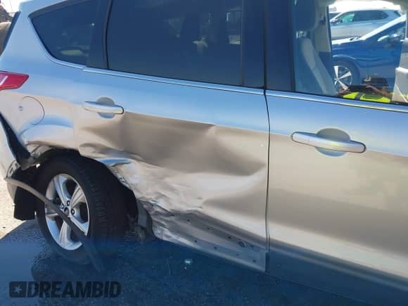 2014 Ford Escape SE with VIN 1FMCU0GX0EUE28246, listed as a IAAI auction lot 43418322 with 69,606 mi miles and . Bid and sale history available at DreamBid. Image 6.