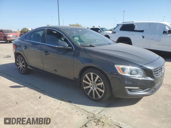 2015 Volvo S60 with VIN YV126MFD0F1309666, listed as a Copart auction lot 77844894 with 130,570 mi miles and Salvage title. Bid and sale history available at DreamBid. Image 4.