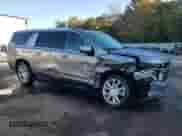 2023 Chevrolet Suburban High Country with VIN 1GNSKGKL9PR328923, listed as a Copart auction lot 77671964 with 32,395 mi miles and Salvage title. Bid and sale history available at DreamBid. Image 4.