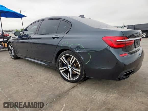 2017 BMW 7 Series 740i с VIN WBA7E2C34HG740975, выставлен на аукционе Copart как лот 71019405 с пробегом 90 805 миль миль и Списание • Salvage title. История ставок и продаж доступна на DreamBid. Изображение 2.