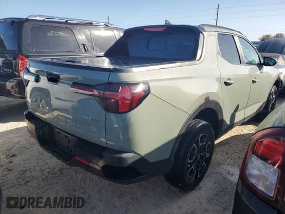 2023 Hyundai Santa Cruz SEL Premium z VIN 5NTJDDAF6PH057322, wystawiony jako Copart lot #77493914 z przebiegiem 21 615 mil mil oraz Nie do naprawy • Non repairable. Historia ofert i sprzedaży dostępna na DreamBid. Obrazek 3.