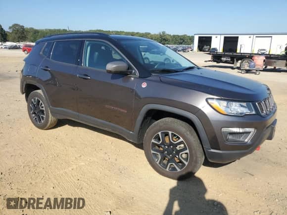 2019 Jeep Compass Trailhawk with VIN 3C4NJDDB2KT713400, listed as a Copart auction lot 84782185 with 63,337 mi miles and Salvage title. Bid and sale history available at DreamBid. Image 4.