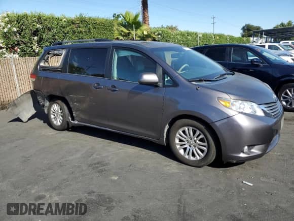 2012 Toyota Sienna XLE AAS with VIN 5TDYK3DC7CS275515, listed as a Copart auction lot 63839725 with 149,968 mi miles and Salvage title. Bid and sale history available at DreamBid. Image 4.