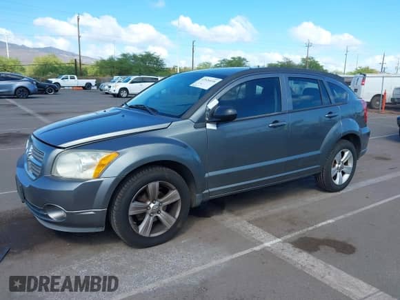 2011 Dodge Caliber Mainstreet with VIN 1B3CB3HA1BD295385, listed as a IAAI auction lot 43526036 with 149,158 mi miles and . Bid and sale history available at DreamBid. Image 2.