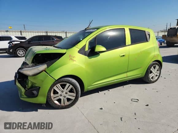 2014 Chevrolet Spark LS with VIN KL8CB6S94EC565436, listed as a Copart auction lot 86057295 with 106,927 mi miles and Salvage title. Bid and sale history available at DreamBid. Image 1.