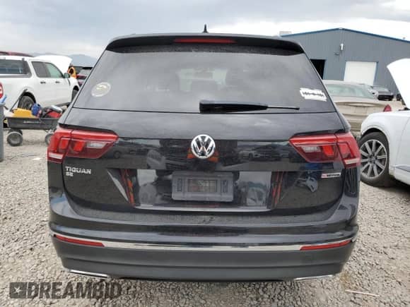 2021 Volkswagen Tiguan SE z VIN 3VV2B7AX0MM001984, wystawiony jako Copart lot #69985025 z przebiegiem Nie podano mil oraz Szkoda całkowita • Salvage title. Historia ofert i sprzedaży dostępna na DreamBid. Obrazek 6.