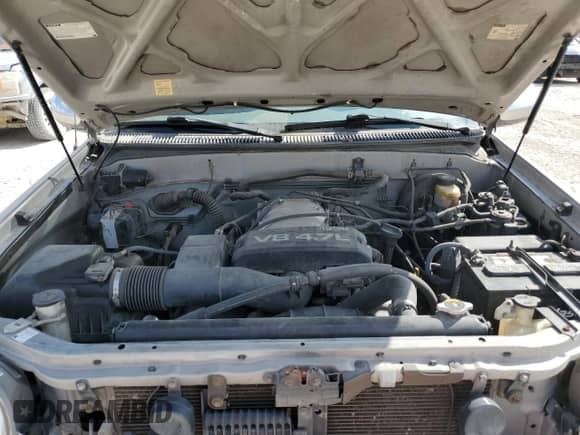 2002 Toyota Tundra SR5 z VIN 5TBRT34132S295977, wystawiony jako Copart lot #82577295 z przebiegiem 218 368 mil mil oraz Czysty tytuł • Clean title. Historia ofert i sprzedaży dostępna na DreamBid. Obrazek 11.