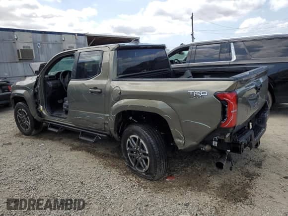 2025 Toyota Tacoma SR5 with VIN 3TMKB5FN5SM037497, listed as a Copart auction lot 80210455 with 2,216 mi miles and Salvage title. Bid and sale history available at DreamBid. Image 2.