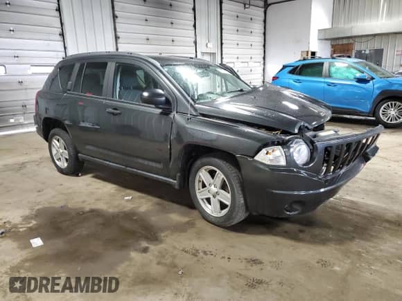2010 Jeep Compass Sport z VIN 1J4NT1FB3AD647153, wystawiony jako Copart lot #61261595 z przebiegiem Nie podano mil oraz Nie do naprawy • Non repairable. Historia ofert i sprzedaży dostępna na DreamBid. Obrazek 4.