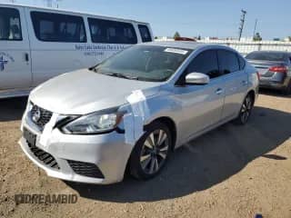 2019 Nissan Sentra S z VIN 3N1AB7AP7KY444345, wystawiony jako Copart lot #84055645 z przebiegiem 98 532 mil mil oraz Czysty tytuł • Clean title. Historia ofert i sprzedaży dostępna na DreamBid. Obrazek 1.