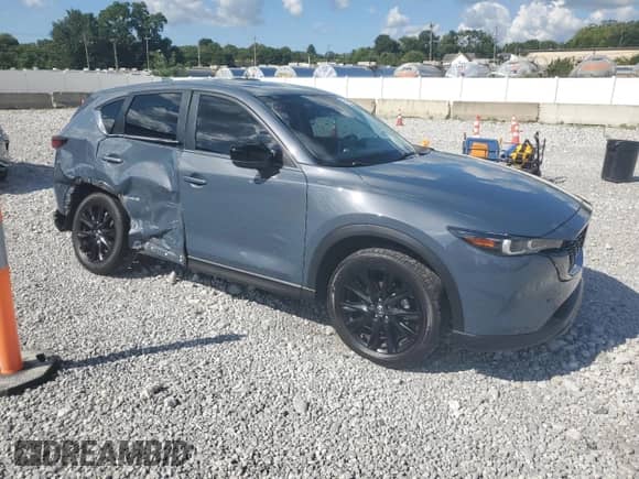 2023 Mazda CX-5 S Carbon Edition z VIN JM3KFBCM7P0169757, wystawiony jako Copart lot #70624645 z przebiegiem 31 275 mil mil oraz Szkoda całkowita • Salvage title. Historia ofert i sprzedaży dostępna na DreamBid. Obrazek 4.