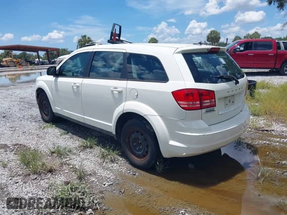 2012 Dodge Journey SE z VIN 3C4PDCABXCT255928, wystawiony jako IAAI lot #42536508 z przebiegiem 148 167 mil mil oraz . Historia ofert i sprzedaży dostępna na DreamBid. Obrazek 3.