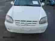 2004 Hyundai Accent GL z VIN KMHCG35C74U303431, wystawiony jako IAAI lot #41725717 z przebiegiem 211 893 mil mil oraz . Historia ofert i sprzedaży dostępna na DreamBid. Obrazek 6.