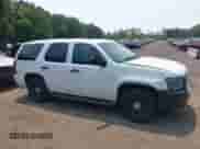 2014 Chevrolet Tahoe Commercial with VIN 1GNLC2E07ER228838, listed as a IAAI auction lot 42410417 with 140,342 mi miles and . Bid and sale history available at DreamBid. Image 13.
