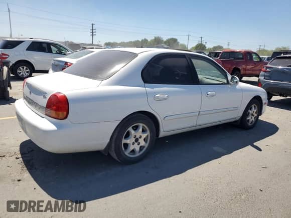 2001 Hyundai Sonata GLS z VIN KMHWF35V31A443345, wystawiony jako Copart lot #65183845 z przebiegiem 87 670 mil mil oraz Szkoda całkowita • Salvage title. Historia ofert i sprzedaży dostępna na DreamBid. Obrazek 3.