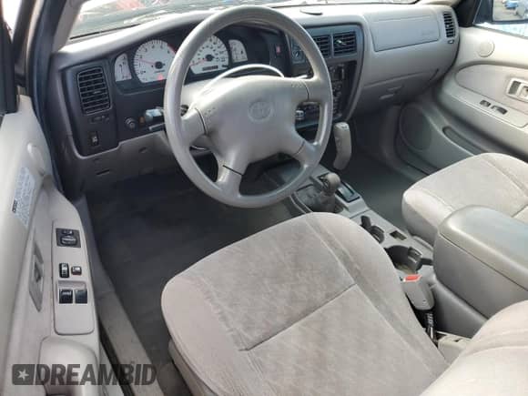 2003 Toyota Tacoma z VIN 5TEWN72N93Z264464, wystawiony jako Copart lot #82414875 z przebiegiem 231 483 mil mil oraz Czysty tytuł • Clean title. Historia ofert i sprzedaży dostępna na DreamBid. Obrazek 8.