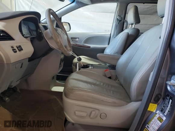 2012 Toyota Sienna XLE with VIN 5TDDK3DC9CS033551, listed as a Copart auction lot 69910445 with 210,288 mi miles and Salvage title. Bid and sale history available at DreamBid. Image 7.