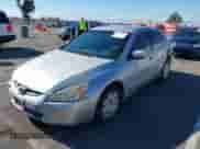 2004 Honda Accord LX with VIN 1HGCM66304A059833, listed as a IAAI auction lot 43271614 with 409,450 mi miles and . Bid and sale history available at DreamBid. Image 2.