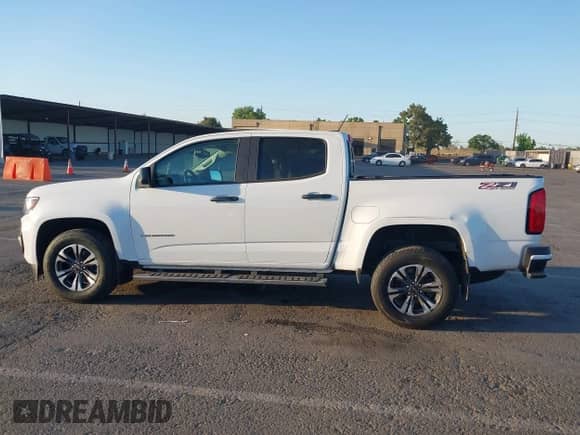 2021 Chevrolet Colorado 4WD Z71 z VIN 1GCGTDEN2M1110856, wystawiony jako IAAI lot #42304561 z przebiegiem 31 155 mil mil oraz . Historia ofert i sprzedaży dostępna na DreamBid. Obrazek 14.